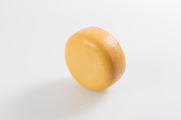 Image showing A piece of fresh processed cheese isolated on a white background