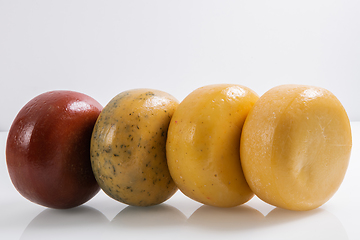 Image showing Different types of homemade traditional Bosnian cheese isolated on a white background