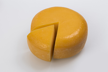 Image showing A piece of fresh processed cheese isolated on a white background