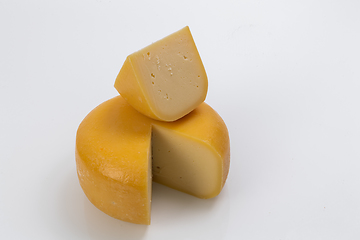 Image showing A piece of fresh processed cheese isolated on a white background