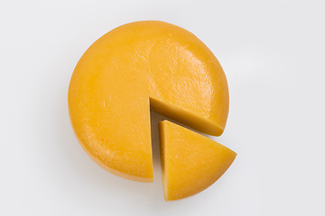 Image showing A piece of fresh processed cheese isolated on a white background