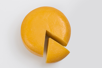 Image showing A piece of fresh processed cheese isolated on a white background
