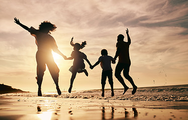 Image showing Silhouette, family jump on beach and sunset with ocean waves, back view and bonding in nature. Energy, people holding hands in air outdoor and holiday, freedom and travel, trust and love in Mexico