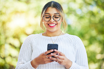 Image showing Woman, phone and texting in park with smile, online date and communication on web chat in summer. Student girl, smartphone and happy for chat, social network app and contact with thinking in nature