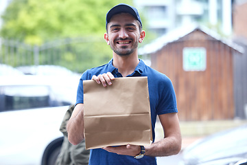 Image showing Happy man, portrait and paper bag for delivery, supply chain or transport of goods in courier service. Friendly male person with parcel, package or cargo for online order, purchase or ecommerce