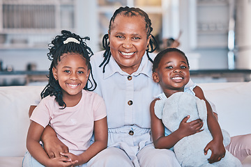 Image showing Black children, portrait and senior grandmother on sofa with quality time with love in family home. Kid, together and happy face on couch with elderly female with care in lounge with smile.