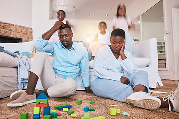 Image showing Home, family and parents with stress, frustrated and playing in living room, busy and burnout. Mother, father and female child with toys, adhd and fast speed in lounge, noise and hyper active kid