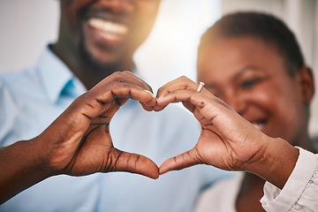 Image showing Hands in heart, love and couple with sign by home with gesture for love, support and care. Emoji, happy and closeup of black man and woman with shape for bonding, commitment and healthy marriage