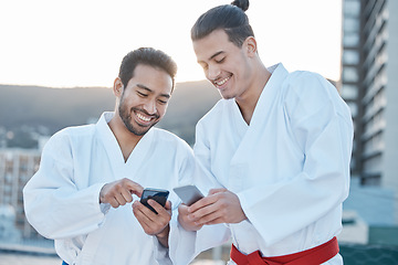 Image showing Happy, karate and men with phone in the city for martial arts, app information or social media. Smile, laughing and friends with a mobile for taekwondo training, fitness or a workout check online