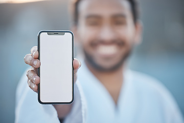 Image showing Sports, fitness mockup or happy man with phone for karate tips, fighting info or martial arts promo code. Portrait blur, screen or mma fighter with mobile app in healthy workout, exercise or training