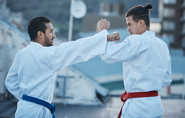 Image showing Men, fight and punch in karate class, training and speed with sparring partner, workout and morning for development. Martial arts team, contest and fitness with mma exercise, coaching or sports