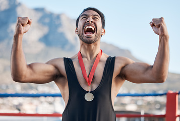 Image showing Winner man, wrestling medal and celebration with scream, success and fist in air for outdoor contest in Cape Town. Young athlete, wrestler and champion with goals, achievement and fight competition