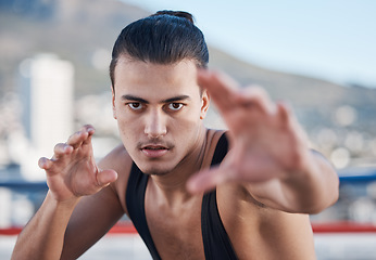 Image showing Fight, portrait and a man doing karate in the city, training for taekwondo or sports competition. Serious, fitness and a professional athlete with a move for a workout or martial arts exercise