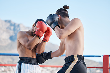 Image showing Punch, boxing match or men fighting in sports training, exercise or fist punching with strong power. Fitness action, boxers or combat fighters boxing in practice workout in ring on rooftop in city