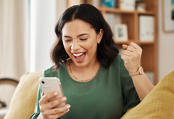 Image showing Phone, winning and celebrate, happy woman on sofa with notification on bonus, deal or discount offer online. Win, social media and girl on couch with smile, cellphone and excited for surprise in home