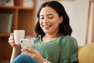 Image showing Happy woman on sofa with phone, coffee and relax, reading email or social media meme in living room. Networking, cellphone and happiness, girl in home with smile, chat and internet search for post.