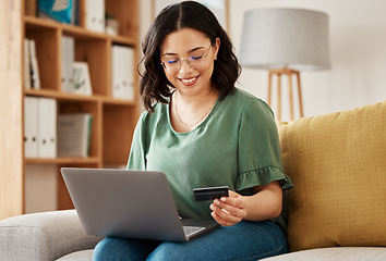 Image showing Online shopping, laptop and credit card, woman on sofa in living room for internet banking app in home with tech. Ecommerce payment, smile and cashback, girl at computer browsing retail website sale.