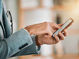 Image showing Business man, hands and phone screen at desk with networking, text and online communication. App, mobile message and social media browse in a office and workplace with contact and typing at company