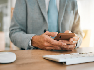 Image showing Business man, hands and phone at desk with networking, text and online communication. Computer, mobile message and social media browse in a office and workplace with contact and typing at company