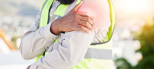 Image showing Man, architect and hands with shoulder pain in city from injury, accident or muscle tension on rooftop. Closeup of male person with sore arm, ache or joint inflammation during construction on site