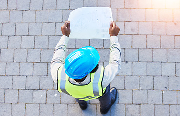 Image showing Construction worker, man and building inspection blueprint with industrial employee from above. African male person, professional and builder paperwork with idea and safety plan for engineer project