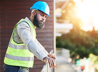 Image showing Construction worker, man thinking and building inspection with industrial employee on a balcony. African male person, professional and builder with vision and safety for engineer project outdoor