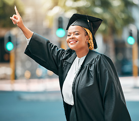 Image showing City travel, student and black woman stop, point or hail taxi, cab or metro bus for transport ride to university graduation. Happy, education and African college person gesture for morning car trip