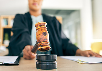 Image showing Law, gavel and black woman judge order the court for an investigation of criminal case in a legal firm. Stop, administration and lawyer working on justice or planning policy in an attorney office