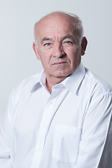 Image showing Senior grey-haired man wearing elegant shirt isolated on white background depressed and worry for distress, crying angry and afraid. Sad expression.