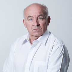 Image showing Senior grey-haired man wearing elegant shirt isolated on white background depressed and worry for distress, crying angry and afraid. Sad expression.