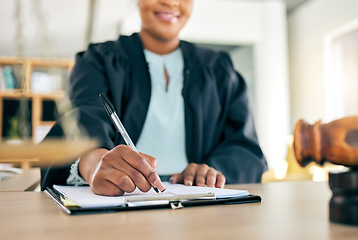 Image showing Legal, scale and hands of black woman lawyer writing for an investigation document or criminal case in law firm. Court, administration and judge working on justice or planning in attorney office