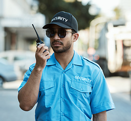 Image showing Walkie talkie, man and a security guard or safety officer outdoor on a city road with communication. Serious male person with radio on urban street to report crime for investigation and surveillance