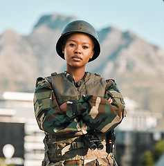 Image showing Soldier, portrait and black woman with arms crossed in city for power, confidence and mindset outdoors. War, combat and face of female warrior proud, hero and ready for army, protection or training