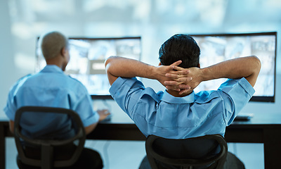 Image showing Security guard, safety and team in control room with a computer screen for surveillance. Behind a man and woman officer relax in office for crime investigation with cctv monitor and camera footage