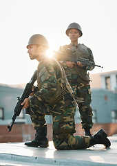 Image showing Army, training and people with gun, defense or power on rooftop for aim, shooting or practice. Military, weapon and black woman with man soldier and sniper rifle for war, target or protection team