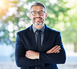 Image showing Face, senior ceo and man with arms crossed outdoor for business, entrepreneurship and professional with smile. Portrait, confident and mature manager, accountant or executive with glasses on bokeh