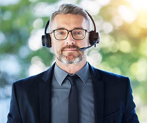 Image showing Call center, portrait and senior man with headset, CRM and contact us with communication and professional headshot. Telecom, customer service and male consultant with help desk employee and mic