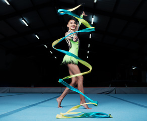 Image showing Girl, portrait and gymnast with ribbon for practice during competition with creative exercise. Dancer, happy and gymnastics string for sports with woman for training with energy for healthy body.