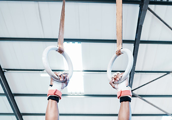 Image showing Hands, gymnastics ring and person in fitness for workout, strength training or competition. Closeup of hanging athlete, strong gymnast or acrobat holding on balance circles for performance exercise