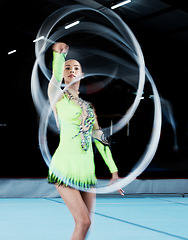 Image showing Gymnastics, sports and woman with ribbon blur in gym for rhythmic body movement, training or exercise. Aerobics performance, health and portrait of female dancer for competition, practice and dance