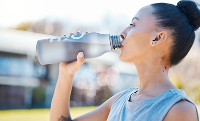 Image showing Drinking water, fitness and woman for outdoor training, exercise and workout nutrition, health or wellness in park. Tired runner or athlete person with liquid bottle for running energy and cardio