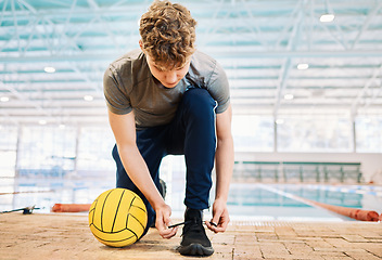 Image showing Shoes, tie and a man water polo coach by a swimming pool in preparation of water sports training in a gym. Fitness, workout and sports with an instructor getting ready for exercise in a health center