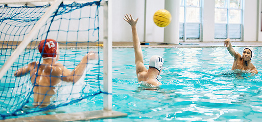 Image showing Teenager, boys and team, water polo and playing game with sports, action and energy in indoor swimming pool. Young male players, high school athlete group and competition with fitness and teamwork