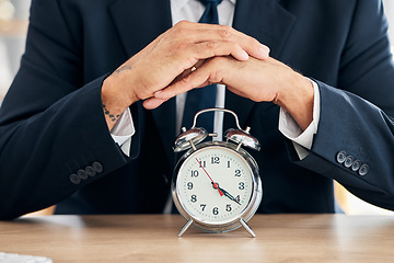 Image showing Clock, business man and time management in office for deadline, punctual and busy schedule. Hands of professional person or broker working at desk with alarm, reminder and timer for goals and agenda