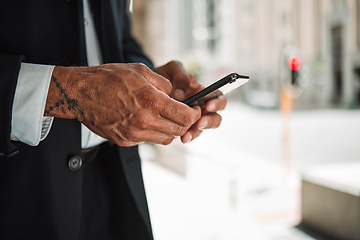 Image showing Hands, phone and navigation with a business man in the city using an app to search for a location or direction. Mobile, travel and communication with a male employee typing a text message closeup