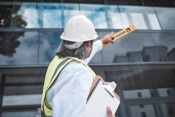 Image showing Engineering, checklist and man with tools at construction site inspection, urban development or city project management. Manager or person from behind for outdoor architecture and clipboard survey