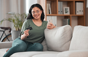 Image showing Credit card, phone and woman for home online shopping, e commerce or fintech payment on sofa. Relax, loan and happy young person with internet banking, e learning subscription or easy web transaction