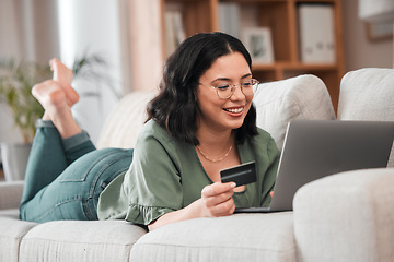 Image showing Credit card, computer and woman for home online shopping, e learning and fintech payment on sofa. Relax, student loan and person on laptop banking, study subscription or website transaction on couch