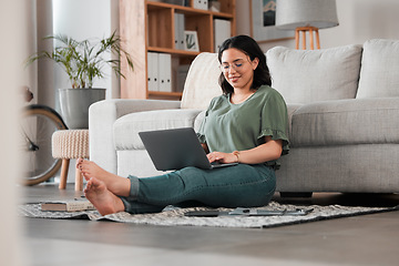 Image showing Woman, remote work and laptop on floor of living room for digital planning, online research and elearning. Happy freelancer working on computer technology for telework, social media and blog at home