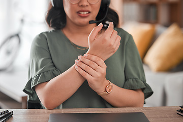 Image showing Woman, hands and wrist pain in remote work from injury, typing or overworked by desk at home office. Closeup of female person or call center consultant with sore ache, joint or carpal tunnel syndrome